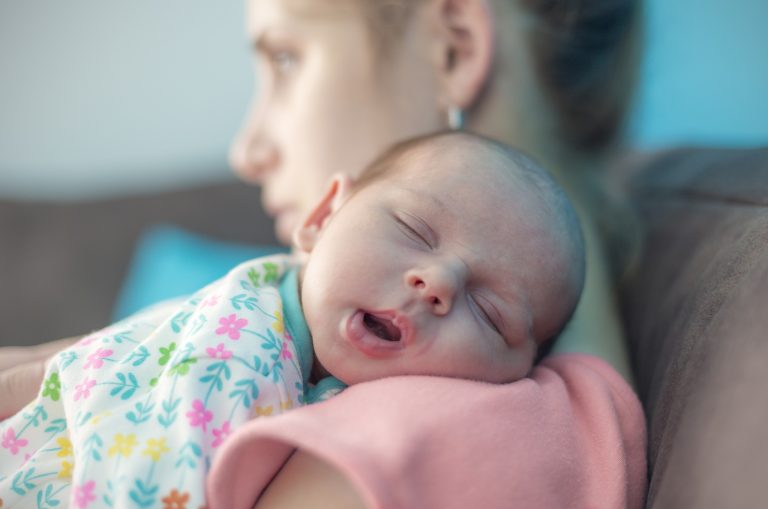 Newborn Baby on Mothers Shoulder